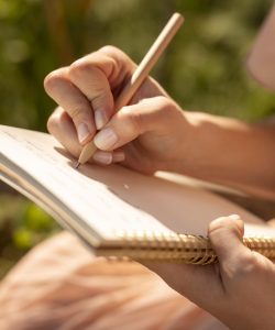 hand-writing-notebook-close-up